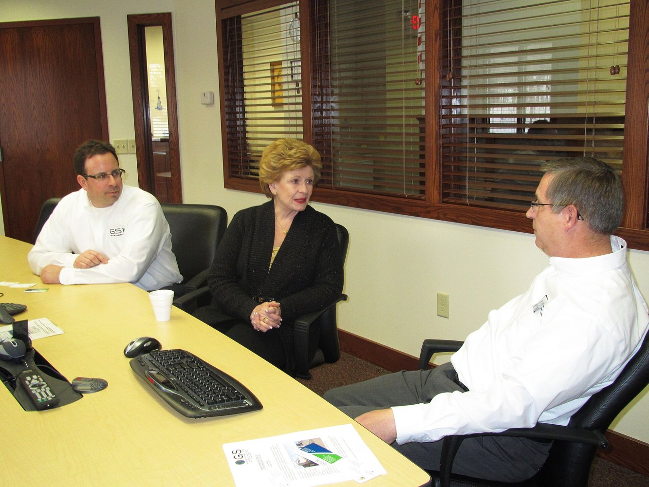 Small business leaders meeting around a table