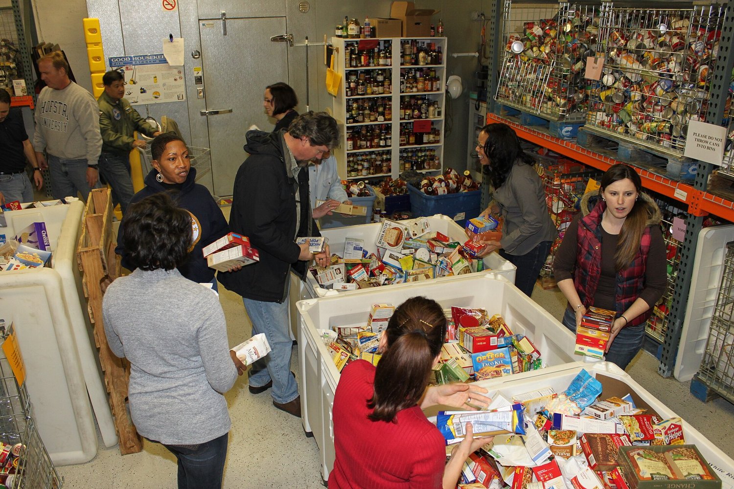 Volunteers sorting donations at a food bank