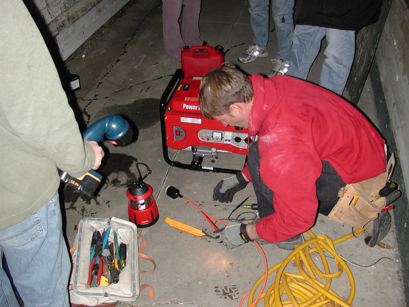 Electricians working with wiring and tools